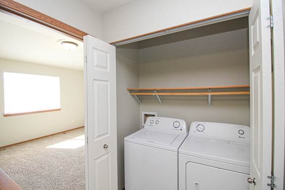 A laundry room with a washer and dryer in it.
