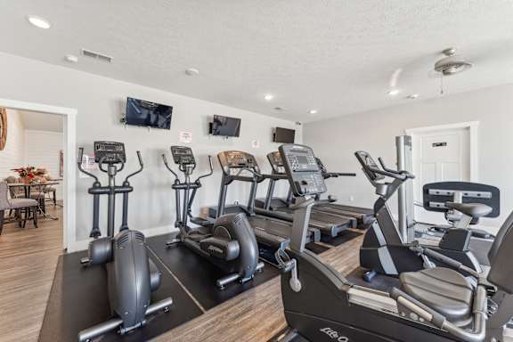 the gym with treadmills and cardio equipment at 1861 muleshoe road apartments