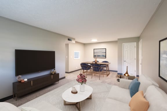 a living room with a couch and a table and a television