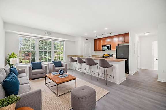 A living room with a grey sofa and a coffee table.