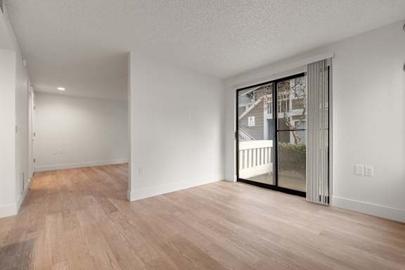 A room with wooden floors and white walls. at AVIA Lofts on Parkway, Vancouver, WA