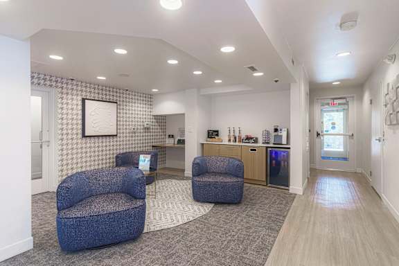 Three couch chairs in a room at AVIA Lofts on Victors Way, Michigan, 48108