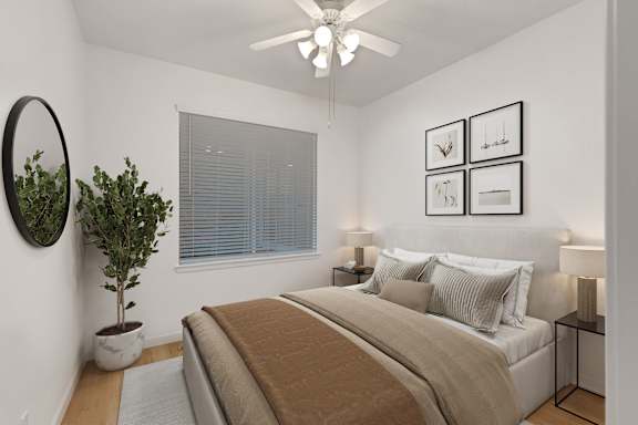 a bedroom with a large bed and a ceiling fan