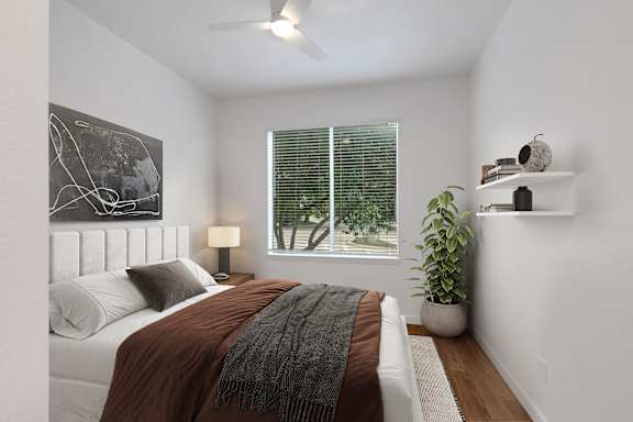 an image of a bedroom with a bed and a window