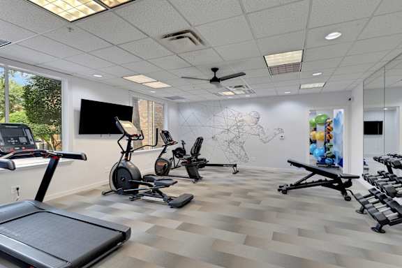 Gym with cardio equipments at AVIA Apartments On Alpha, Dallas, TX, 75240