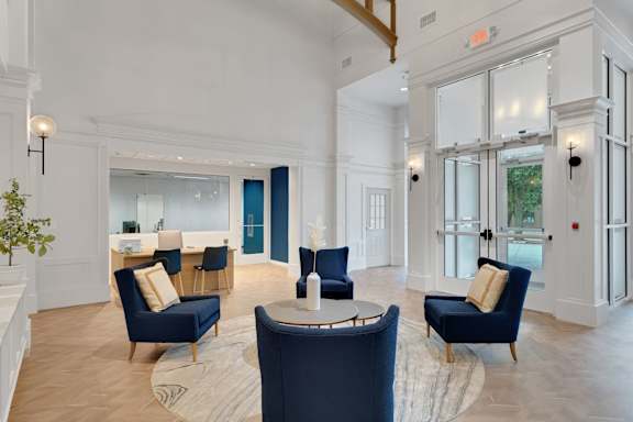 Lobby with chairs at AVIA Apartments On Alpha, Dallas, 75240