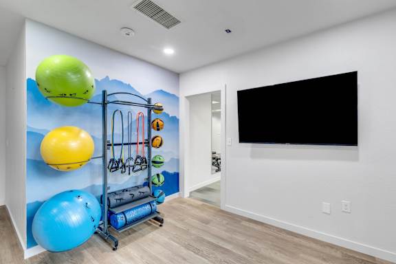 Workout room at AVIA Apartments On Alpha, Dallas, TX