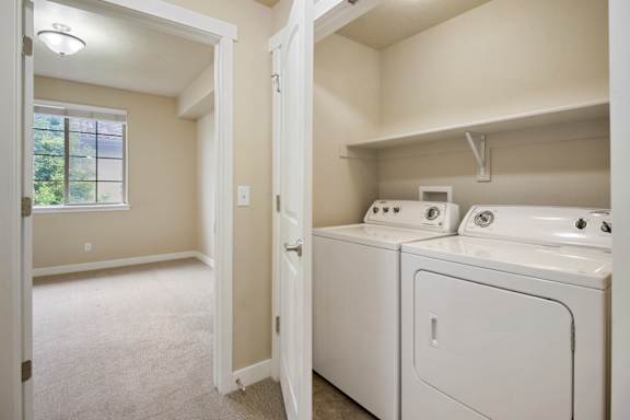 A laundry room with a washer and dryer.