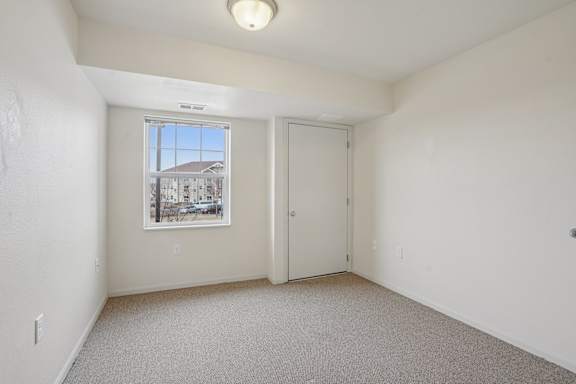 A room with a window and a door is shown.