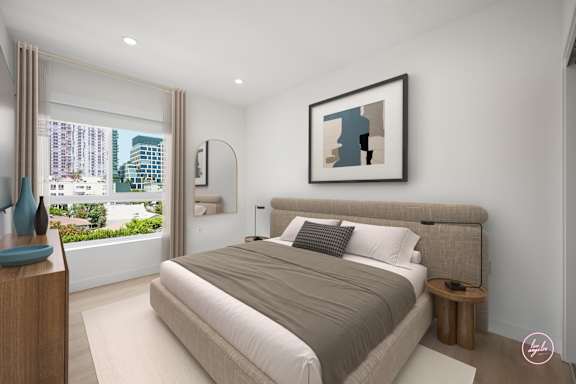 A bedroom with a large bed and a picture on the wall.