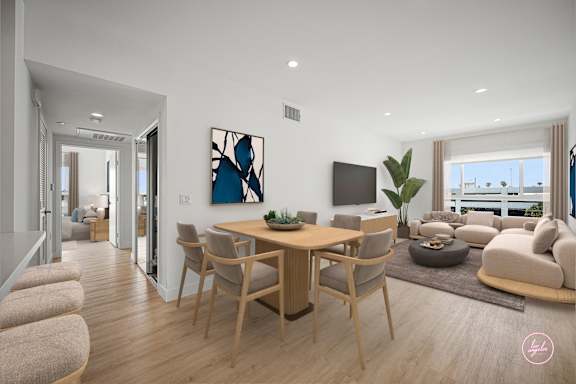 A modern living room with a dining table and chairs.