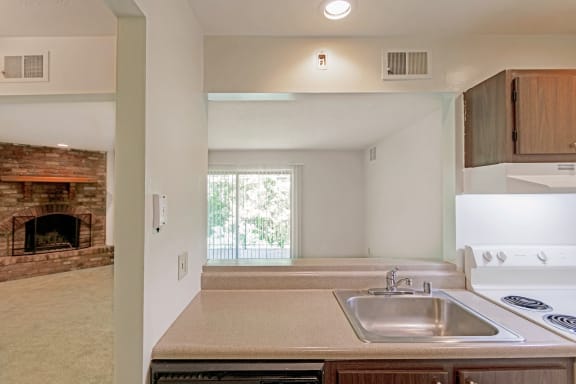 This is a photo of the kitchen of a 1245 square foot 2 bedroom apartment at Cambridge Court Apartments in Dallas, TX.