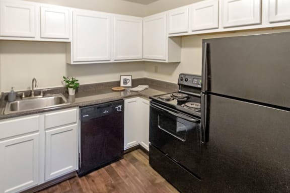 This is a photo of the kitchen of a 1245 square foot 2 bedroom apartment at Cambridge Court Apartments in Dallas, TX.