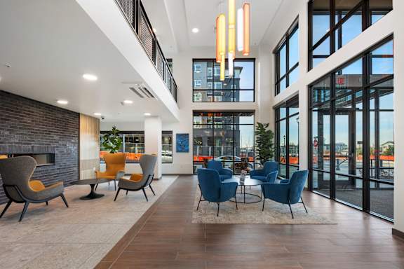 a living room with chairs and a table and a television at Four Corners, Everett
