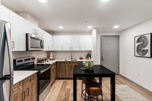 Modern Kitchen with Black Table at Solera Apartments, Renton, Washington