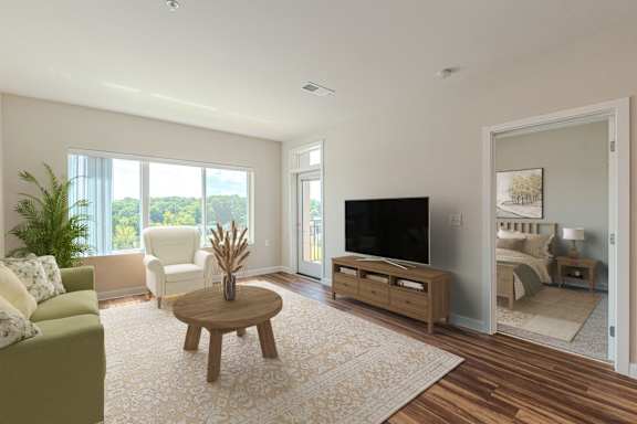a living room with a couch and a tv at Shannon Reserve 55+ Apartments, Union City, GA