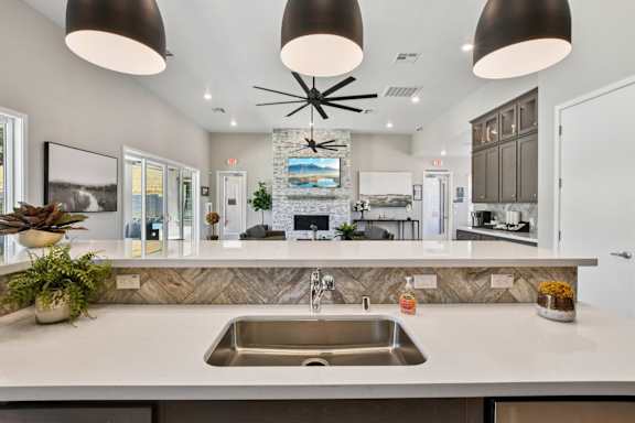 A Kitchen with a Large Island at Montessa Apartments, California, 95687