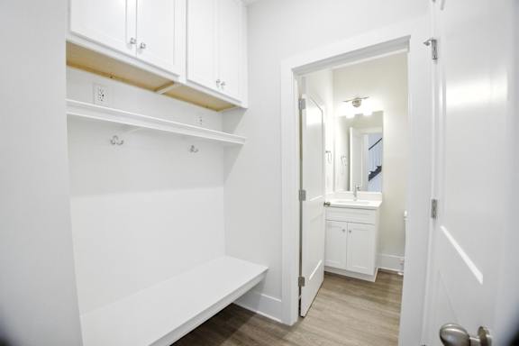 A white bathroom with a toilet and sink.