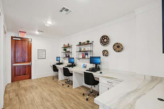 Room with desk and chair at Harrisburg Lofts, Texas, 77003