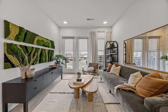 Spacious Living Room at Adler Montford Park + Drexel Townes Apartments, Charlotte