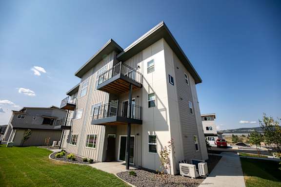 Building with a sidewalk in front of it  at River Landing at Mirabeau, Washington, 99216
