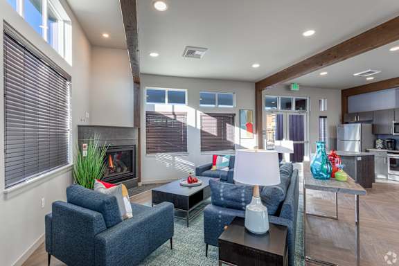 A living room with a fireplace and a couch.