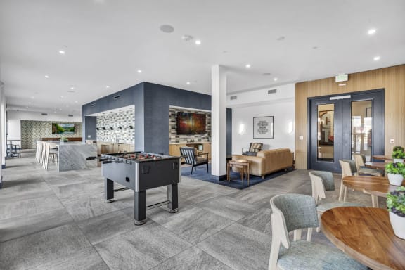 a room with a pool table in the middle