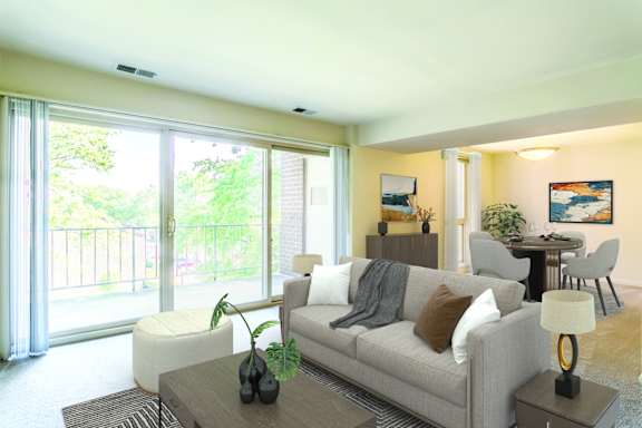 a living room with a couch and a table at Copper and Quarry Village, Pikesville, 21209