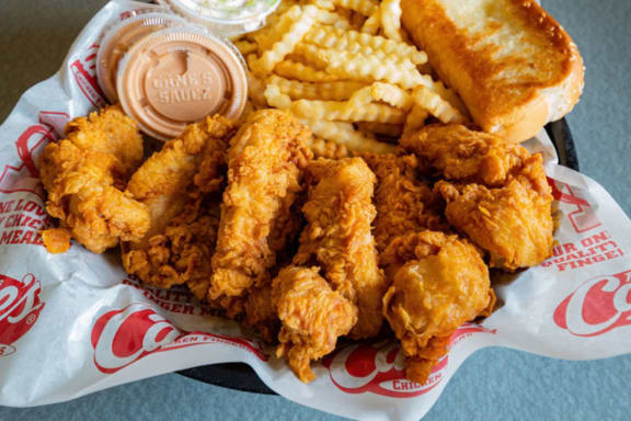 a basket of chicken tenders fries and a sandwich