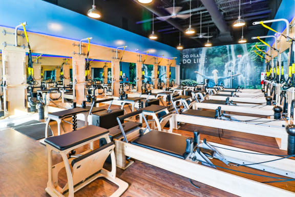 a gym with rows of desks and chairs in a large room