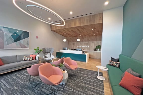 a lobby with couches and chairs and a reception desk