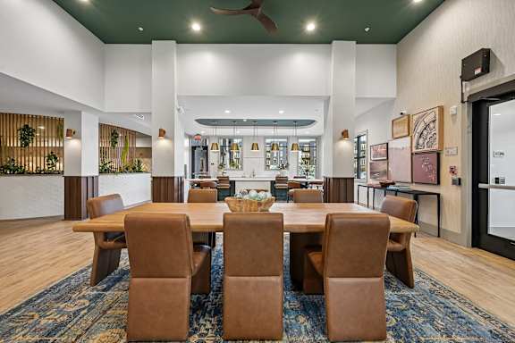 a kitchen and dining room with a table and chairs