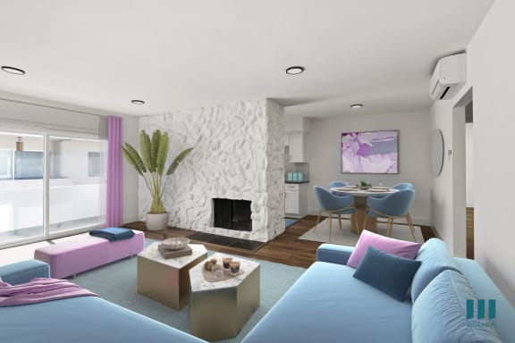 a living room with a blue couch and a table with yellow chairs