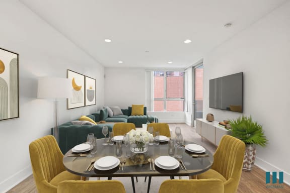 a kitchen with gray cabinets and white countertops