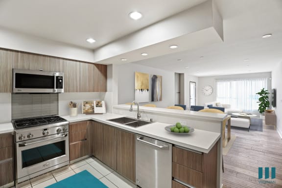 a kitchen and living room in a 555 waverly unit