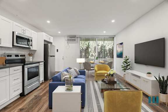a living room with a blue couch and a coffee table