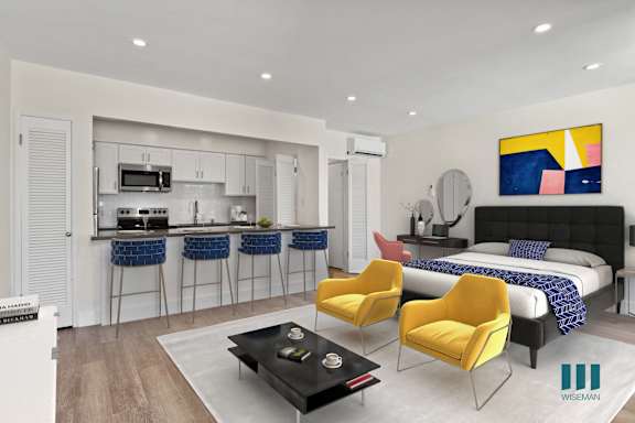 a dining area with yellow chairs and a round dining table