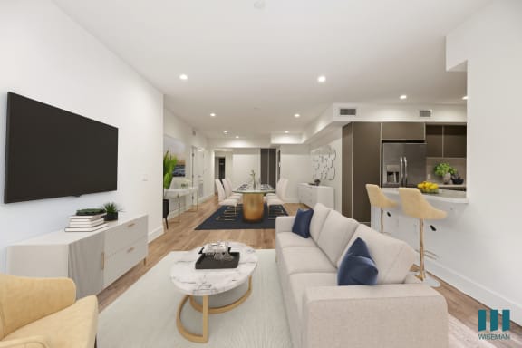 a living room filled with furniture and a flat screen tv