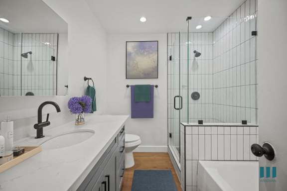 a bedroom with a bed and a door to a patio