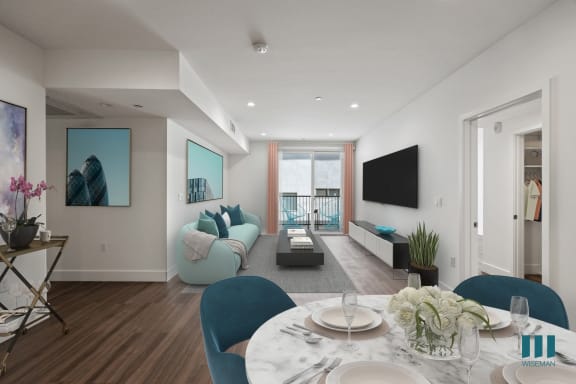 a living room with a blue couch and a coffee table