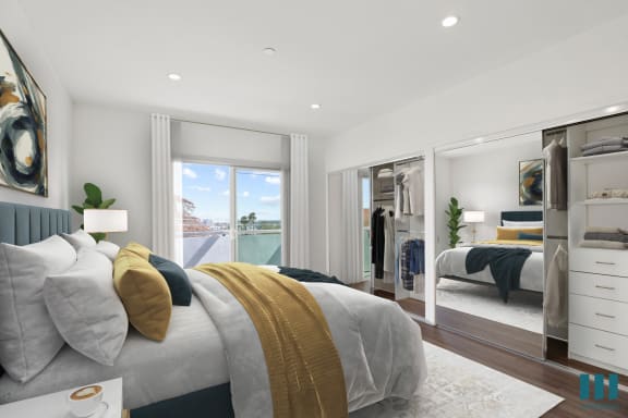 a bedroom with a bed and a mirror