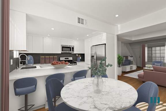 a living room with a couch and chairs and a table