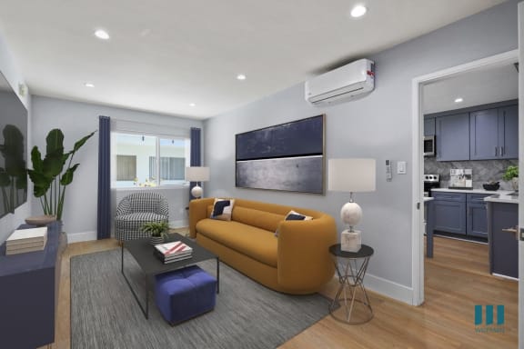 a living room with a blue couch and a table with yellow chairs