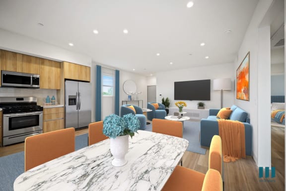 a living room with a blue couch and a table and chairs