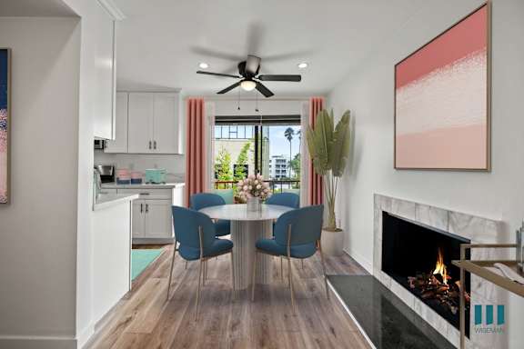 a kitchen with stainless steel appliances and white cabinets