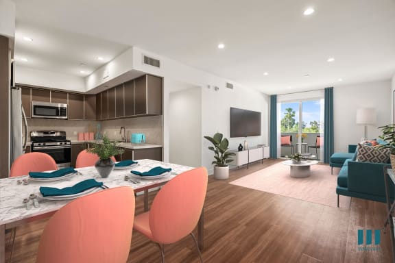 a kitchen with black cabinets and a turquoise rug
