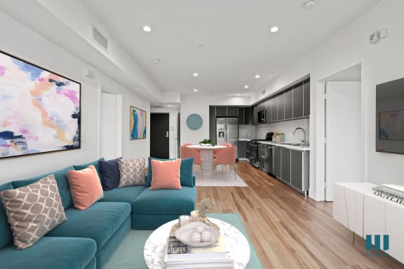 a living room with a blue couch and a tv