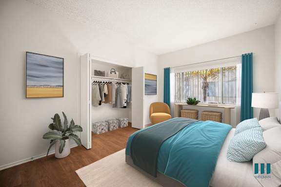 a patio with chairs and a table outside of a house