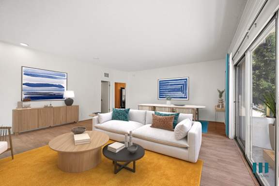 a living room with a couch and a table  and a bed
