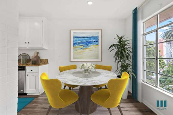 a living room with a couch and chairs and a table